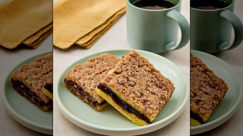 Marketside Cinnamon Coffee Cake sliced into four pieces on a plastic tray