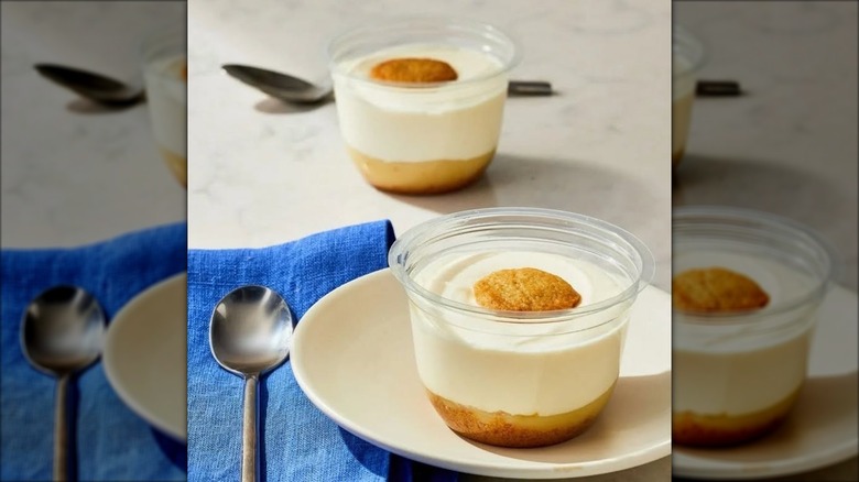 Two Patti's Good Life by Patti LaBelle pudding cups with spoons and a blue napkin on a table
