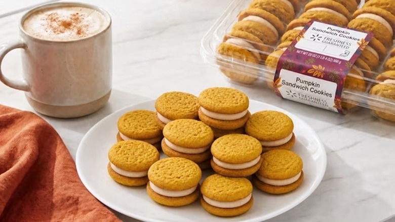 A white plate filled with Freshness Guaranteed Harvest Pumpkin Sandwich Cookies from Walmart.