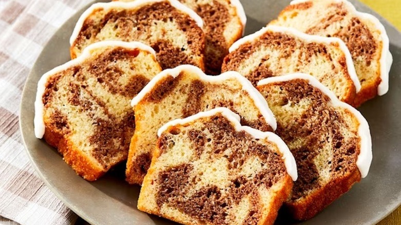 A grey plate filled with Walmart's Iced Cinnamon Sliced Loaf Cake.