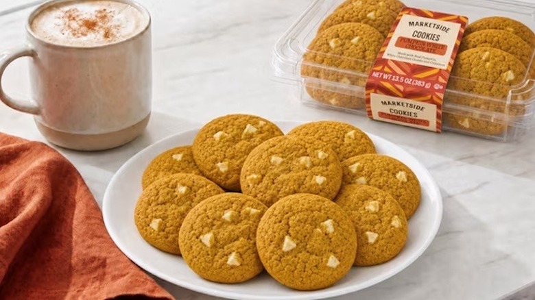 Marketside Pumpkin White Chocolate Cookies sit on top a white plate.