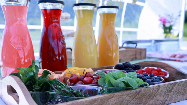 juices, herbs, and fruits for make-your-own mimosa bar
