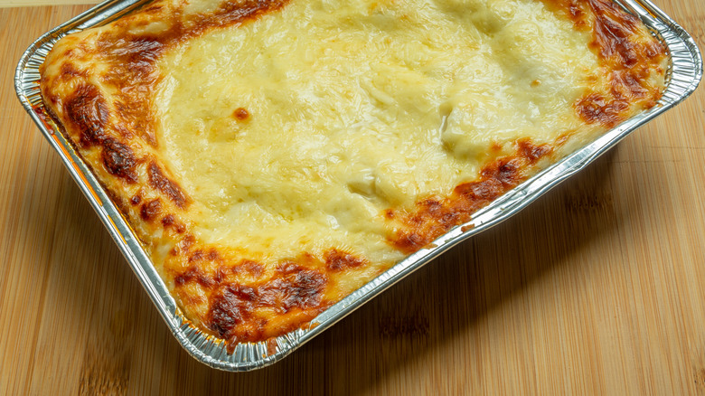 frozen lasagna in a disposable foil pan