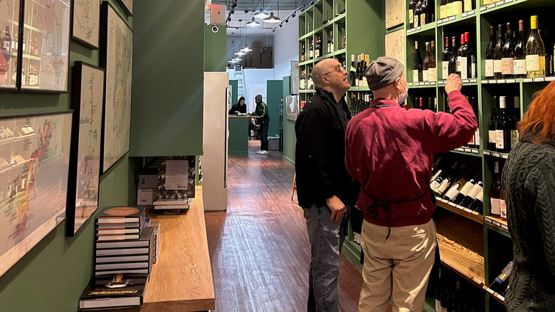 Two men look at wines at Chambers Street Wines