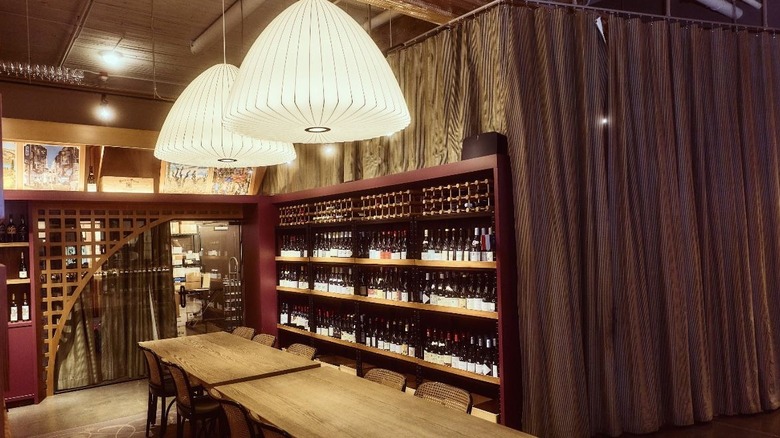 Wood table and wine shelves at Flor