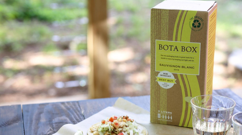 A box of Bota Box Sauvignon Blanc on a picnic table