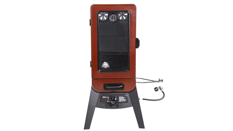 A red and black vertical smoker