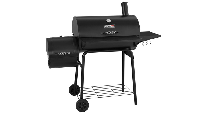 Black barrel smoker with lid closed