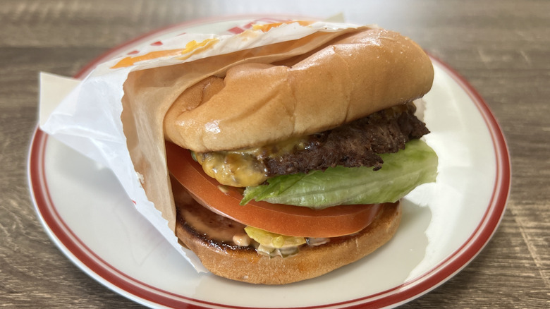 In-N-Out burger in wrapping on white plate