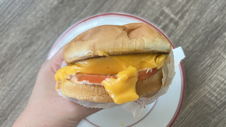 Hand holding In-N-Out Grilled Cheese