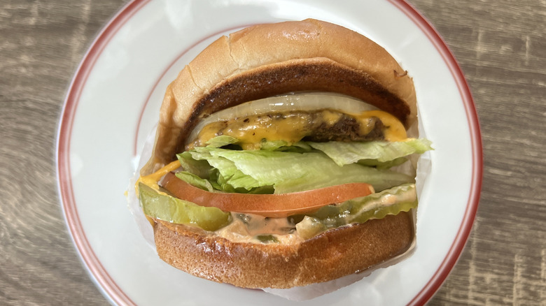 In-N-Out cheeseburger on white plate