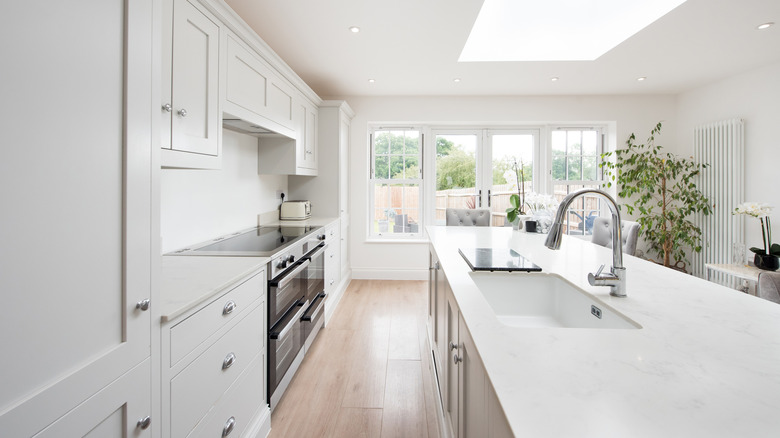 clean, white kitchen with quartz counters