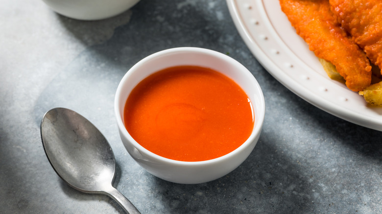 Spoon next to Buffalo sauce