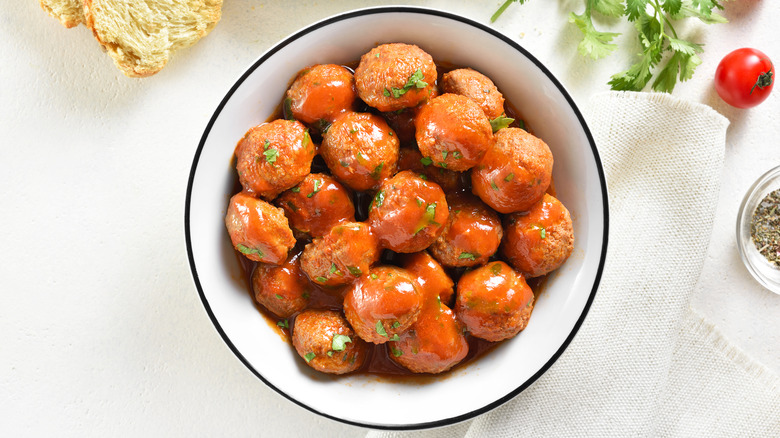 Plate of meatballs against white background