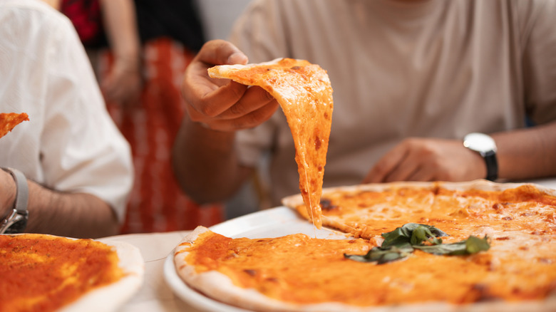 The World's Largest Pizza Slice Takes Over LA, Feeding 7 People For $40