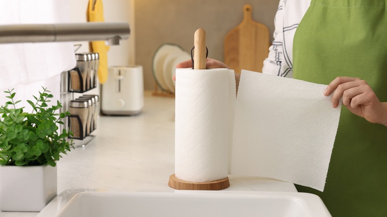 Person ripping paper towel