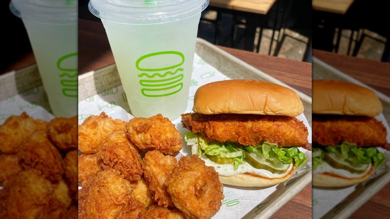 Shake Shack chicken sandwich next to chicken nuggets on tray in resturant.
