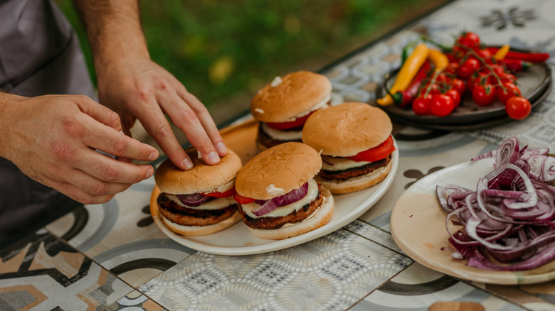 Fully assembled burgers on plate