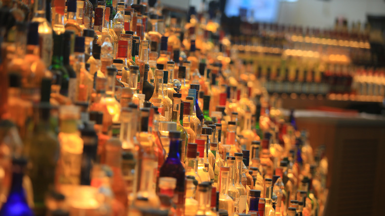 Many bottles of liquor at a bar