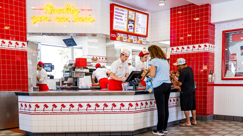 Customers ordering at the counter inside In-N-Out