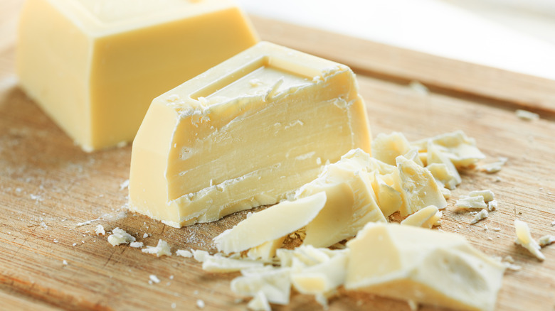 chopped white chocolate on a wooden cutting board