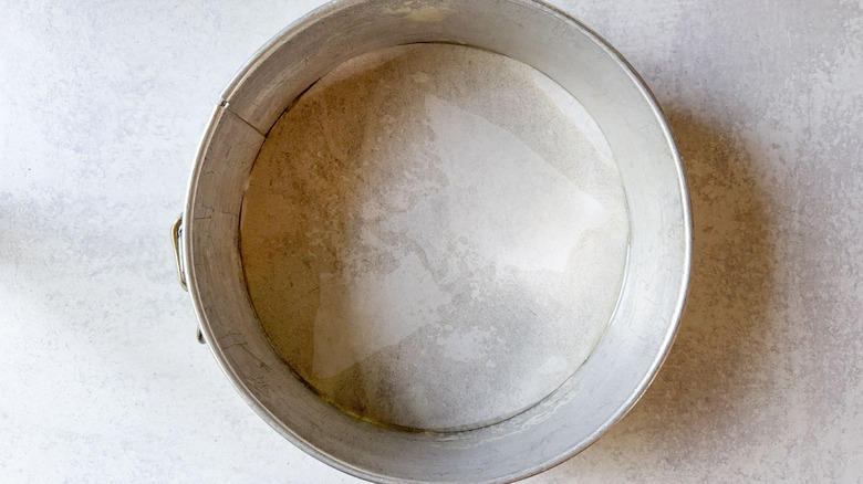 Springform pan lined with parchment paper