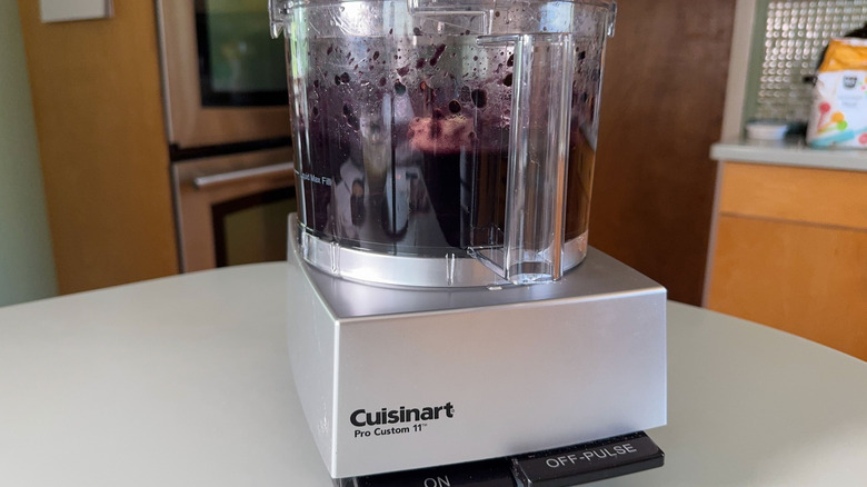 Pureed blackberries in food processor