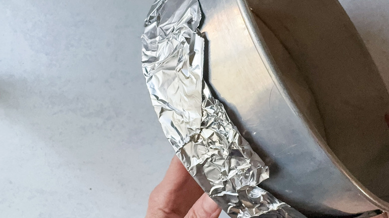 Springform pan wrapped with foil on the outside