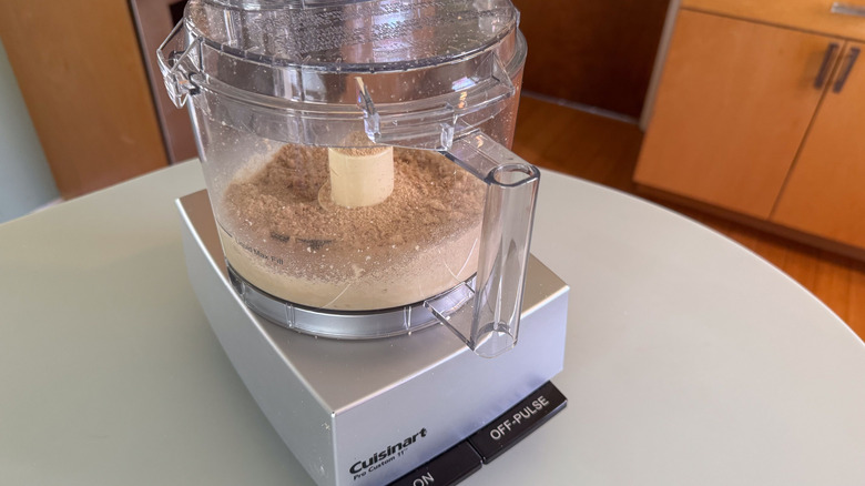 Pine nuts and graham cracker crumbs in food processor