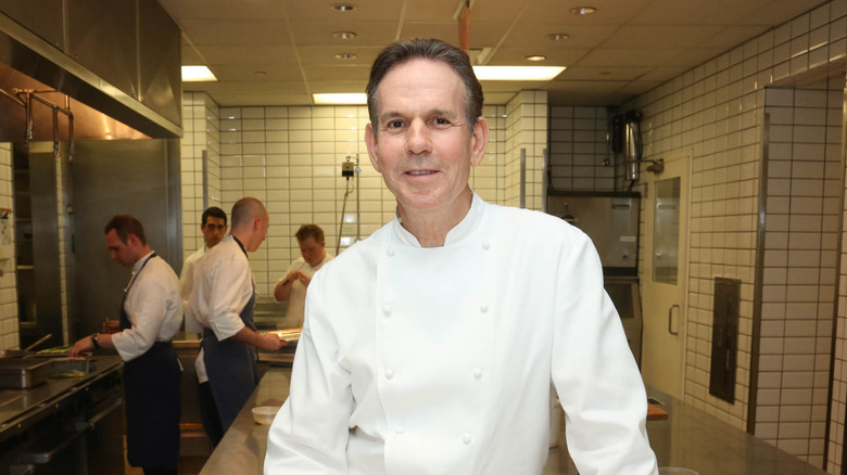 Thomas Keller smiling in a kitchen