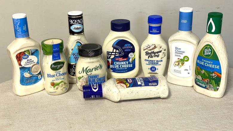 nine blue cheese dressings arranged on a table