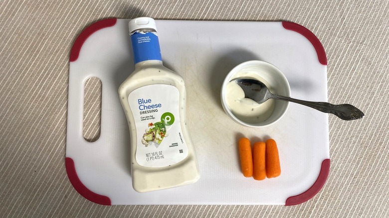 Publix Blue Cheese dressing on a table with sample and baby carrots