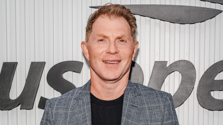Bobby Flay smiling at an event