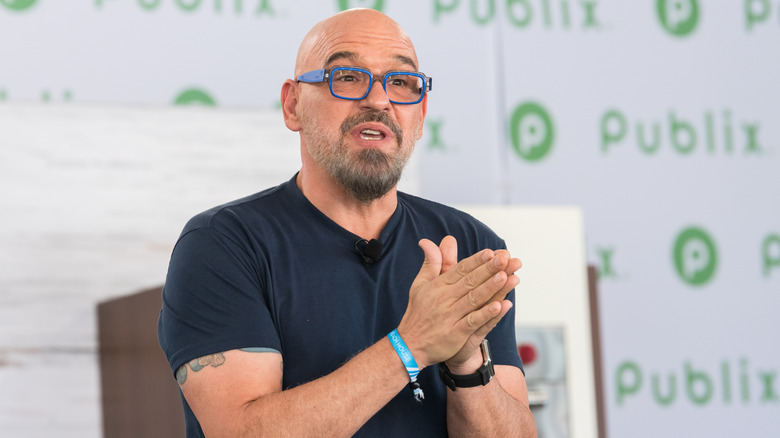 Michael Symon performing a cooking demo