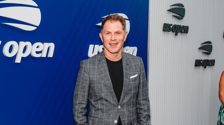 Celebrity chef Bobby Flay at a red carpet event.