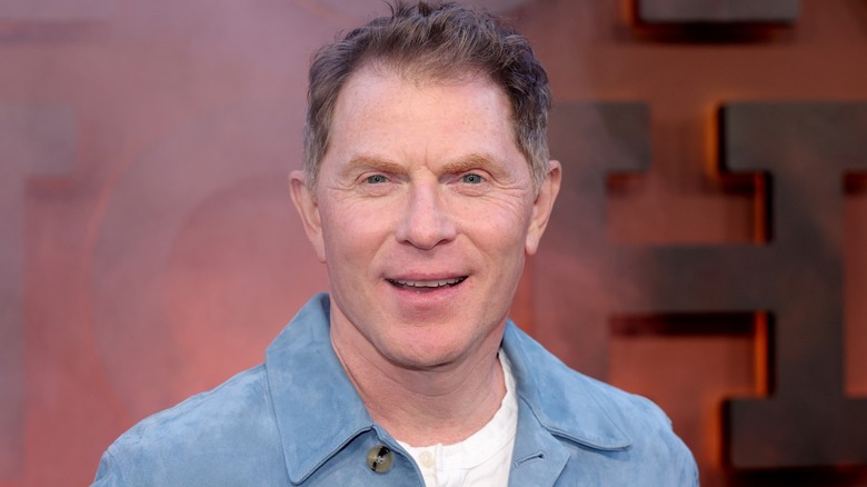 Celebrity chef Bobby Flay poses at a movie premiere.