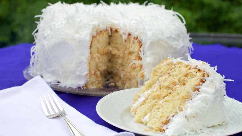coconut cake with a slice pulled out