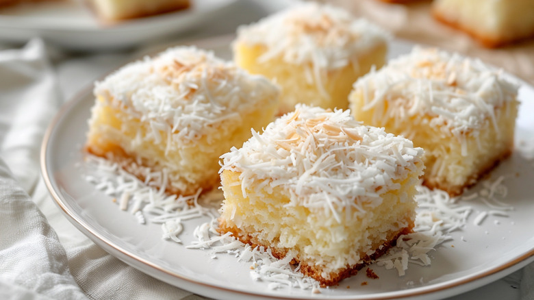 pieces of coconut bar on a white plate