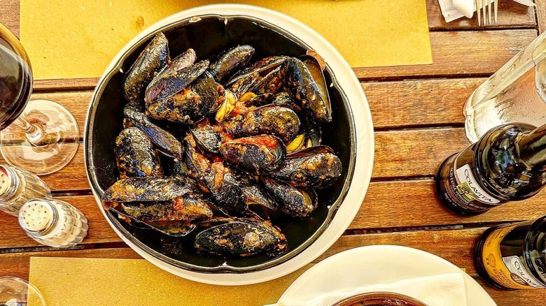 A bowl of mussels on a table at Da Adolfo on the Amalfi Coast