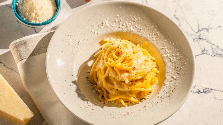 A bowl of cacio e pepe pasta at Roscioli Ristorante Salumeria in Rome