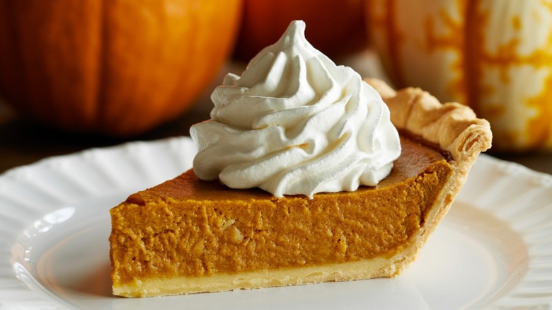 pumpkin pie with homemade whipped cream