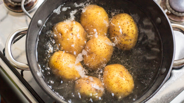 potatoes boiling in sauce pan