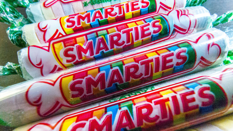 A closeup of rolls of Smarties candies.