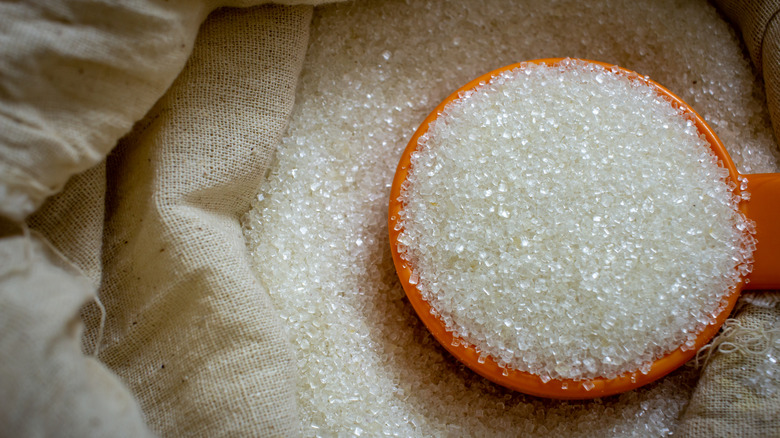 A bowl of white cane sugar.