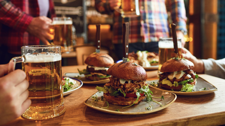 beers and burgers at a bar