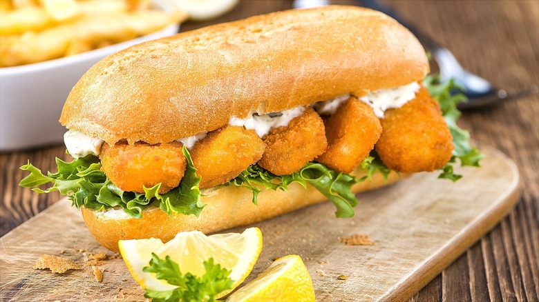 Fish stick sandwich on a hoagie roll with lettuce and tartar sauce