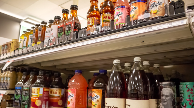 Assorted bottled sweet teas on a store shelf
