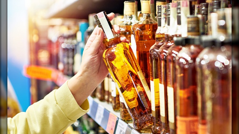 Picking whiskey from a shelf