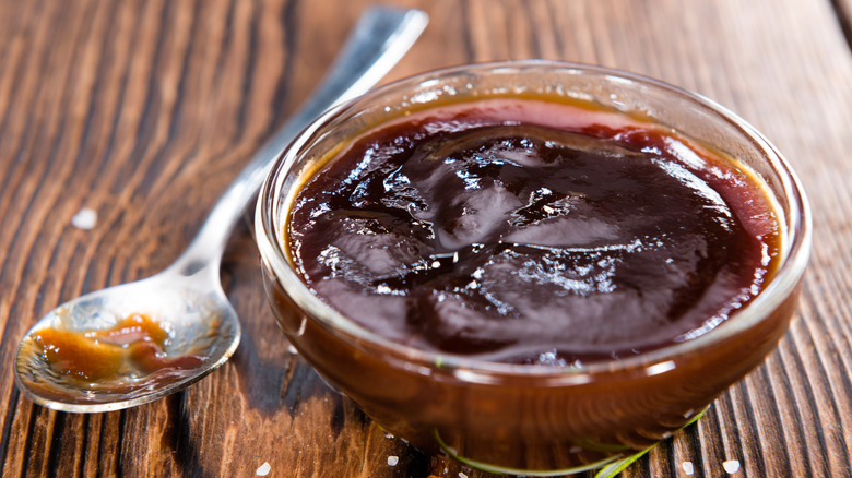 A glass bowl of barbecue sauce