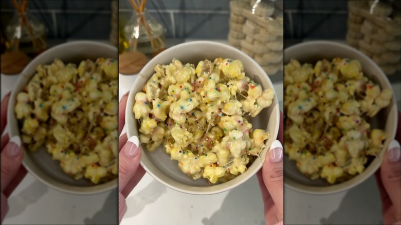 A bowl of marshmallow popcorn with sprinkles.